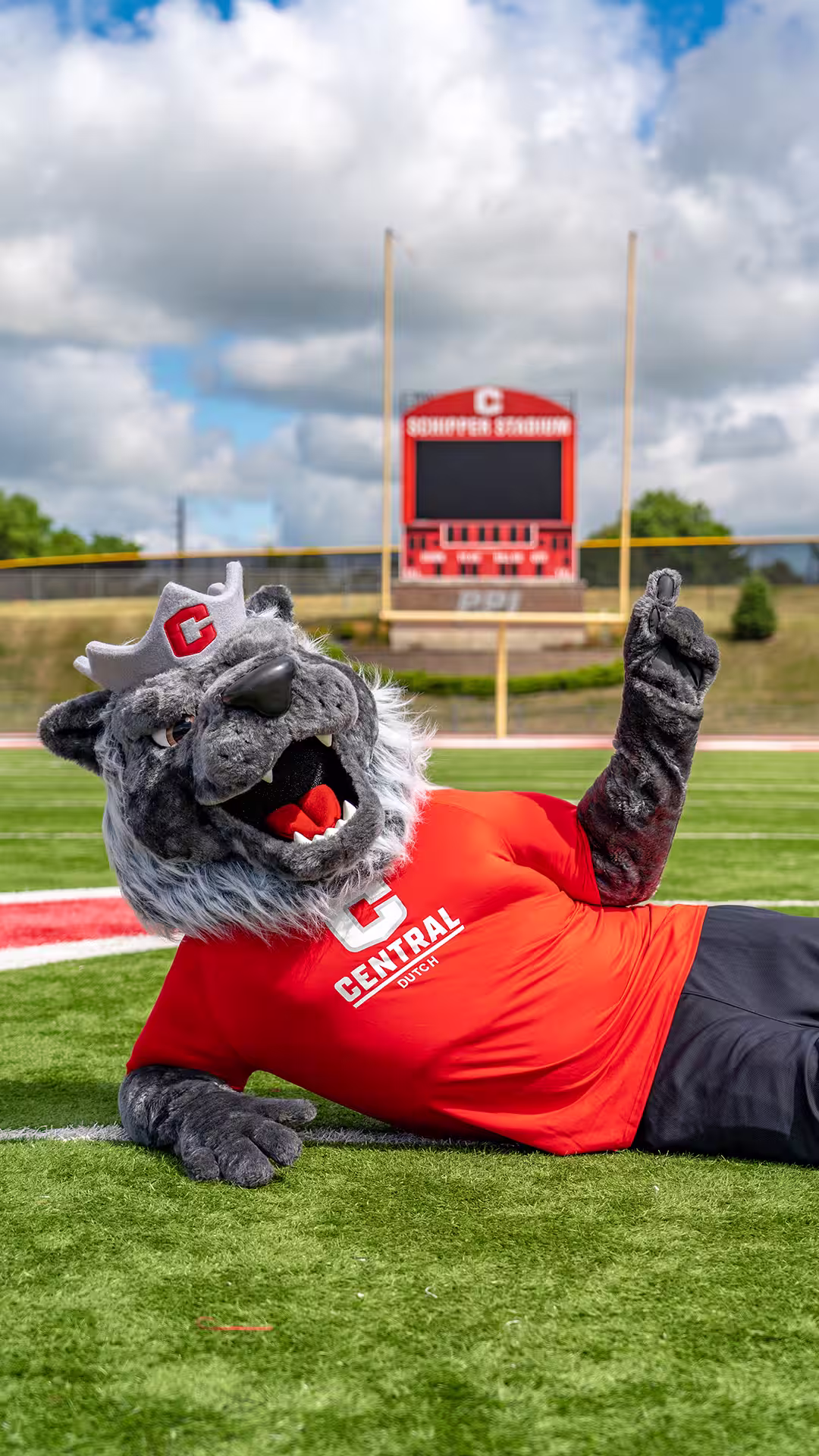 Big Red laying on the football field